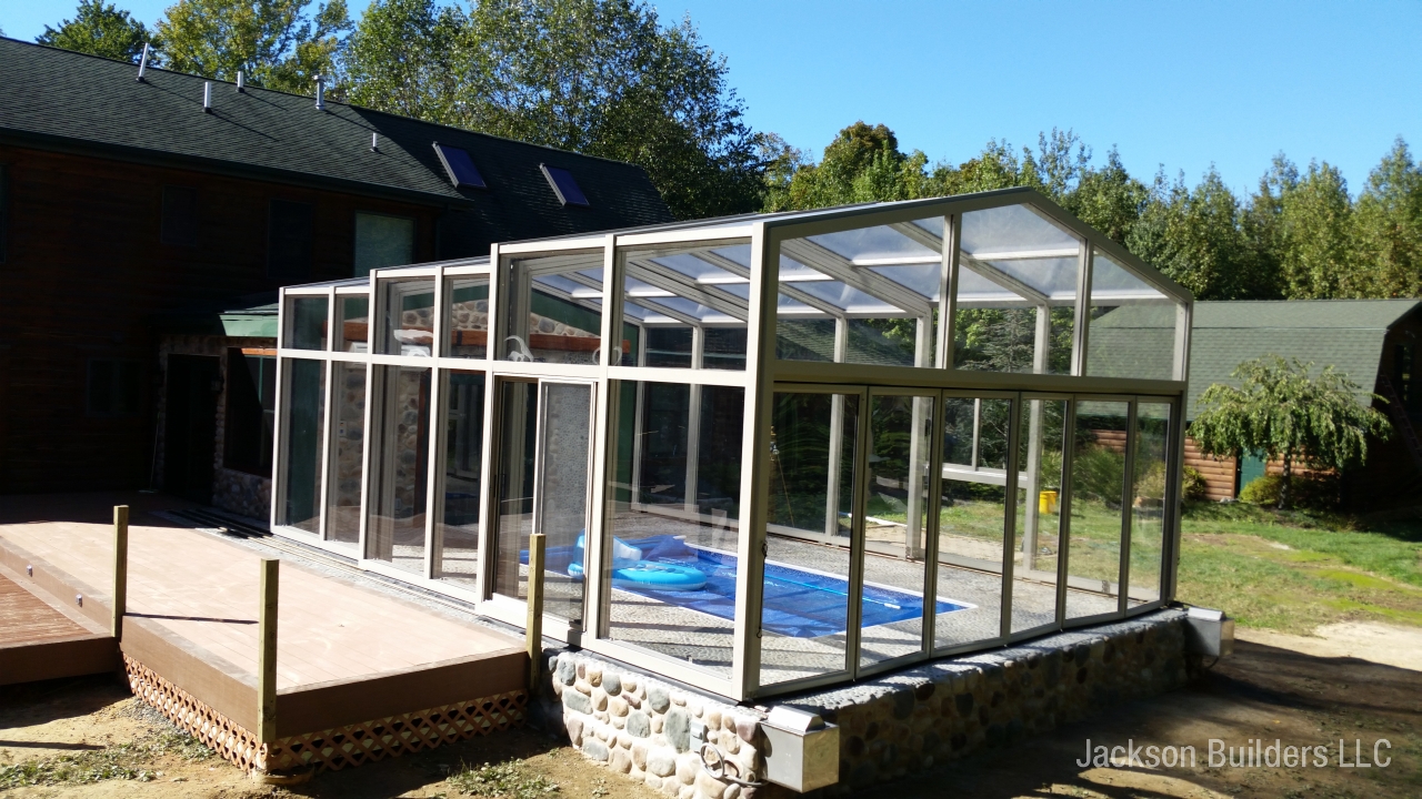 Glass sunroom pool enclosure