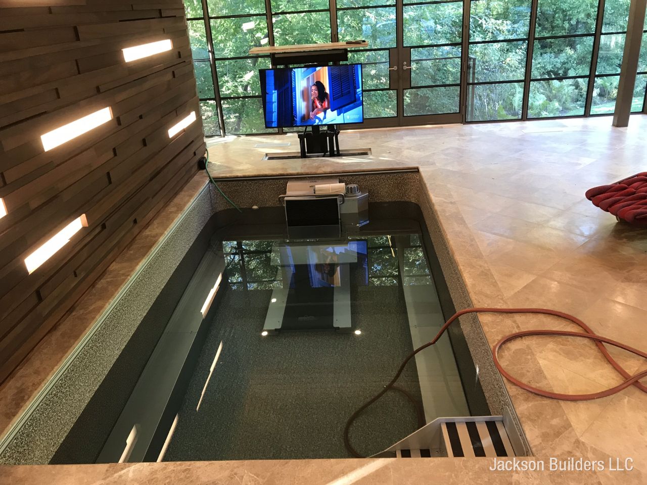 Custom indoor pool with glass walls